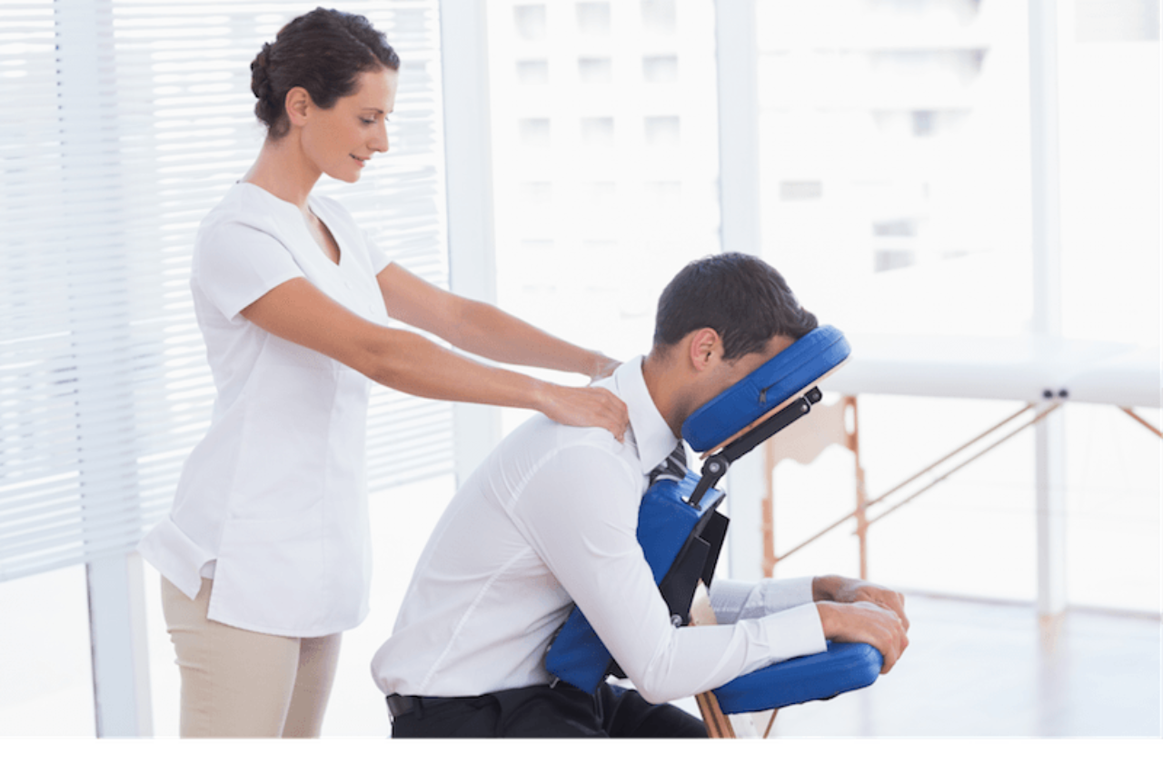 woman-giving-man-chair-massage