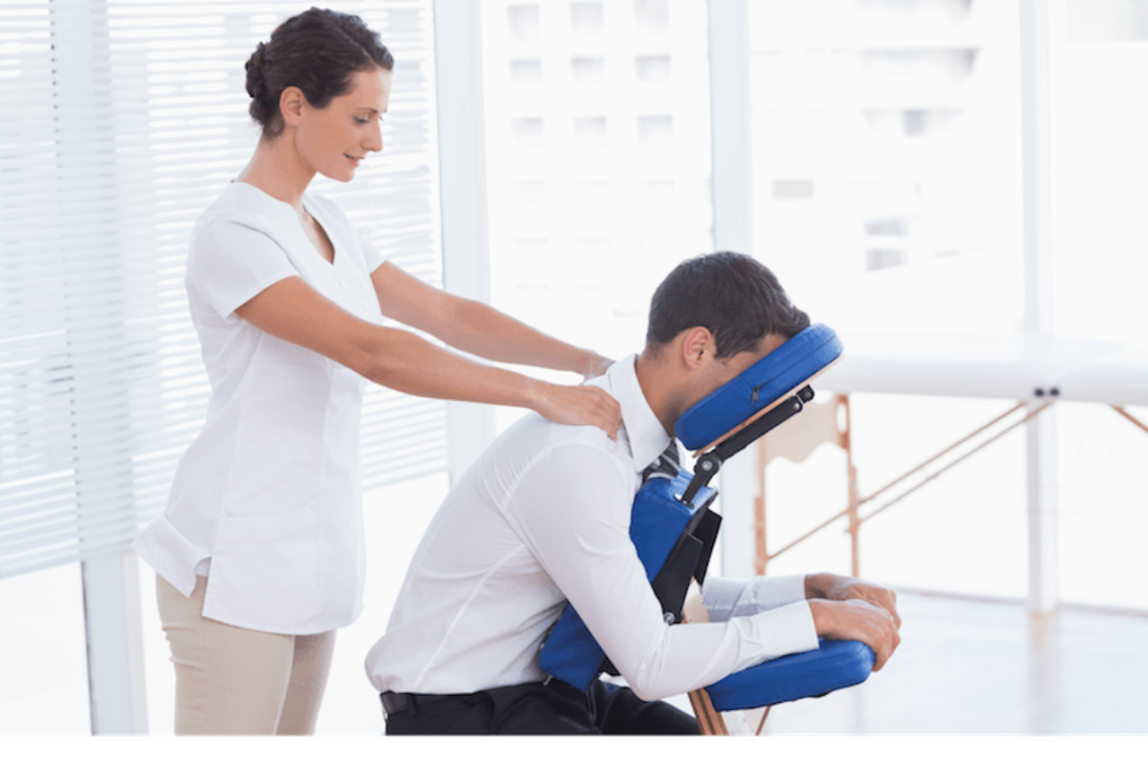 woman-giving-man-chair-massage