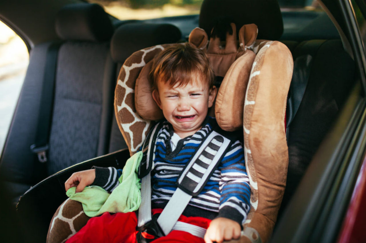 upset-child-in-car-seat-AdobeStock_96733919