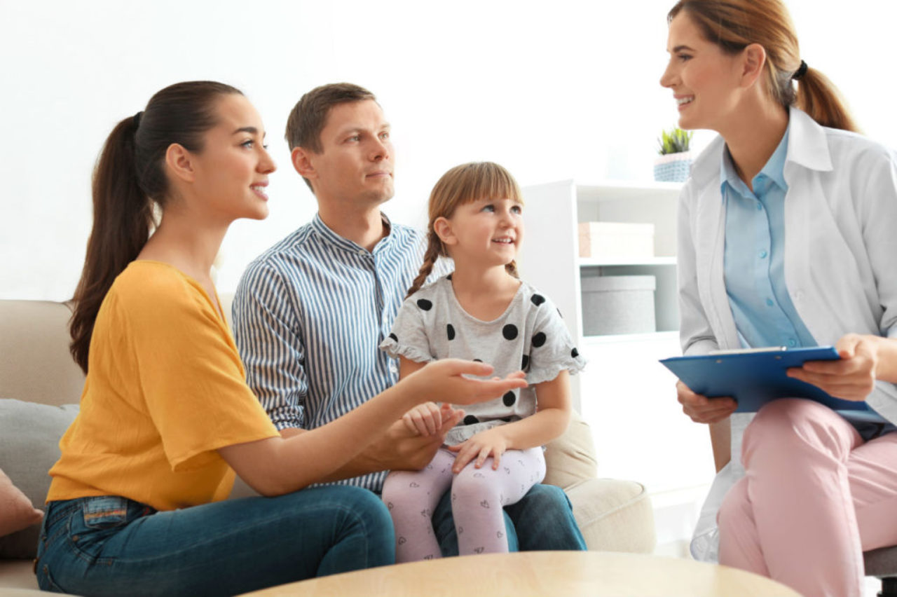 female-doctor-house-call-with-family