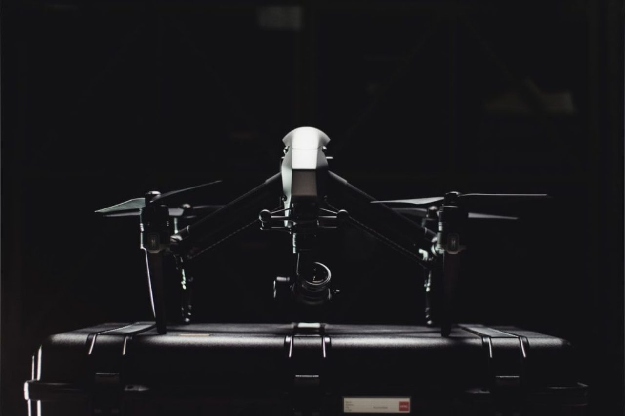 black-and-white-photo-of-drone-sitting-on-top-of-case