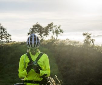 cyclist-stopped-reading-map-on-smartphone