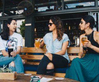 three-women-holding-clear-glasses-1267699