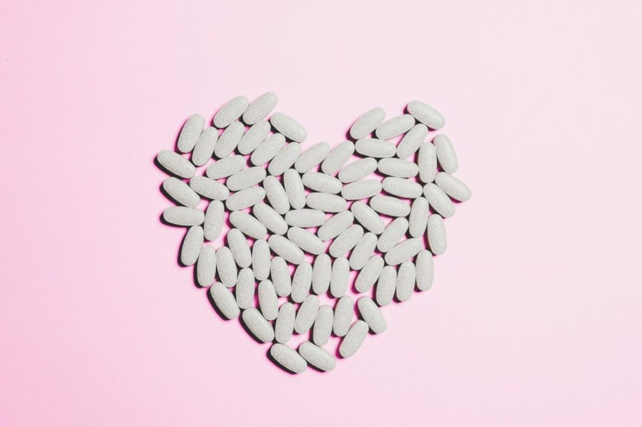 blue-medicine-pills-on-heart-shape-3683046