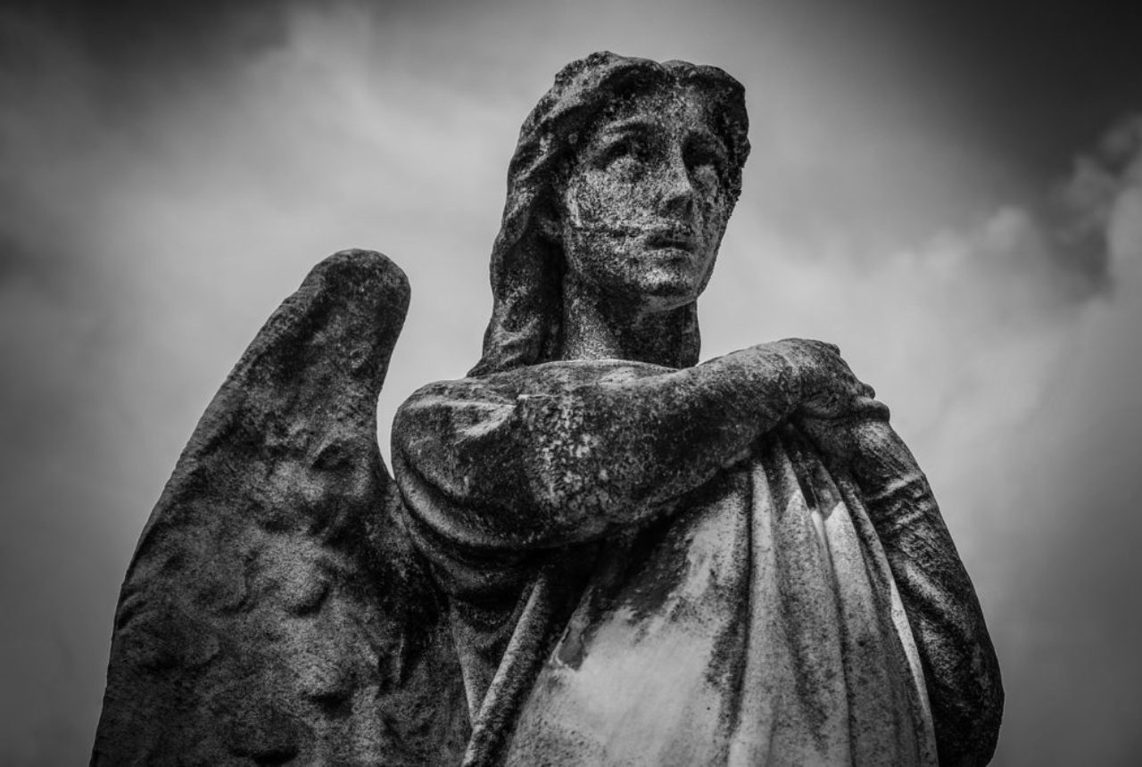 black-white-photo-of-stone-angel-statue-taken-with-a-red-filter