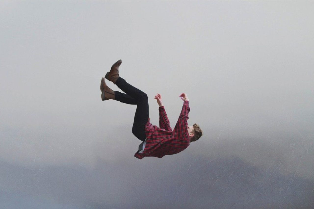 man-in-red-plaid-shirt-falling