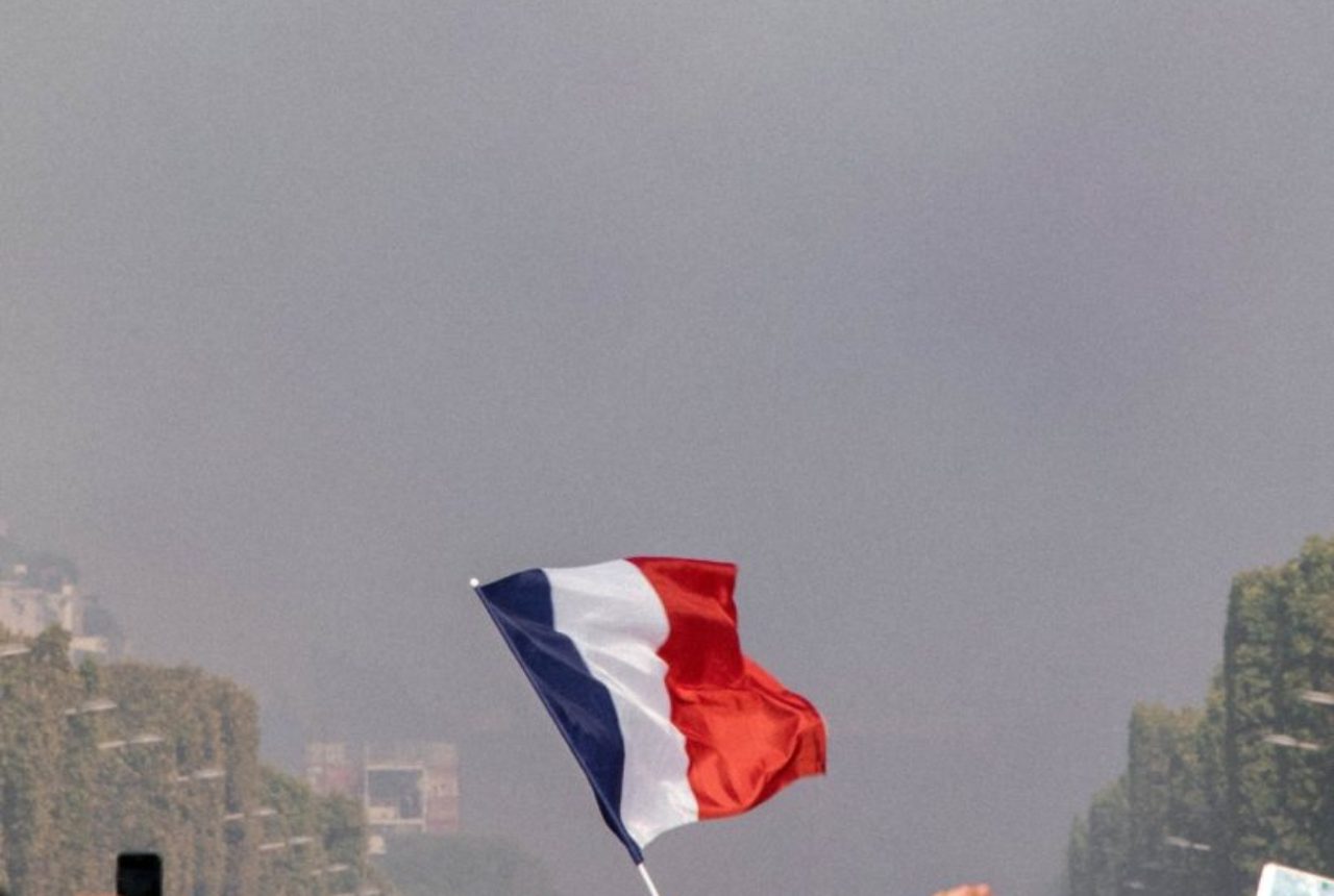 raising-the-blue-red-and-white-french-flag-2267338