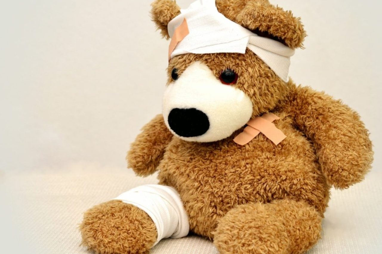 brown-and-white-bear-plush-toy-